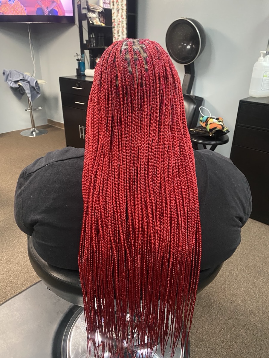 Inside 3JJJ Hair Braiding — styling stations and a relaxed salon space