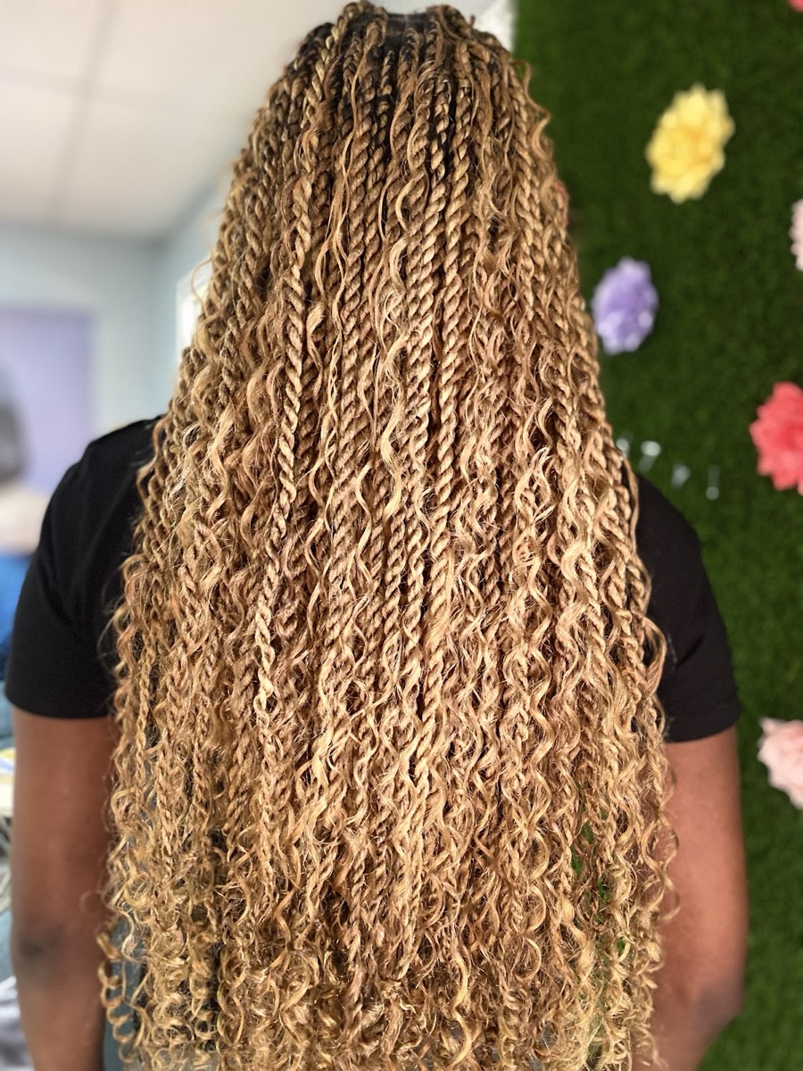 Long honey-blonde boho goddess braids styled at 3JJJ Hair Braiding