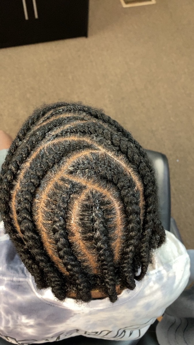 Men's cornrow design with clean parts at 3JJJ Hair Braiding