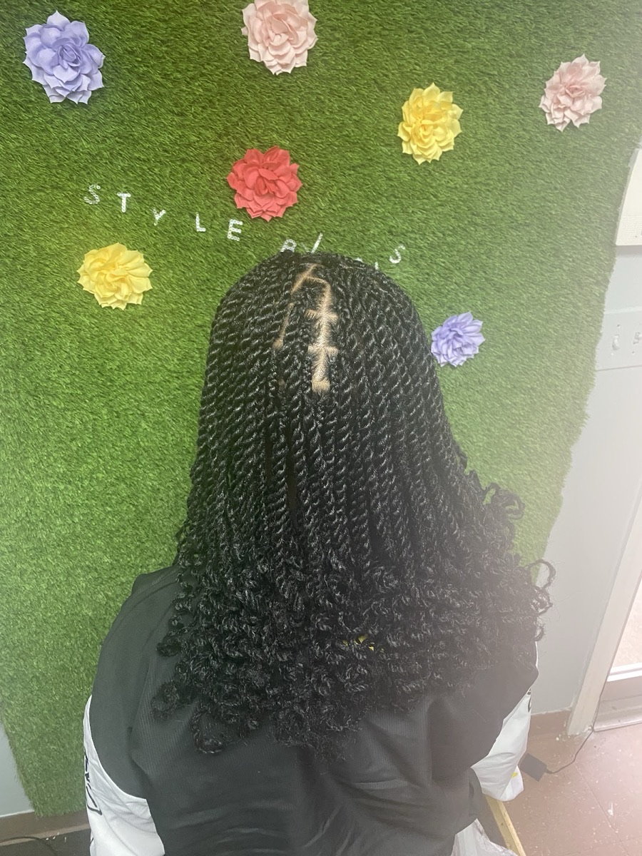 Two-strand twists with a defined center part at 3JJJ Hair Braiding